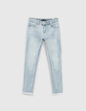 Jean skinny bleach blue avec bas frangés fille