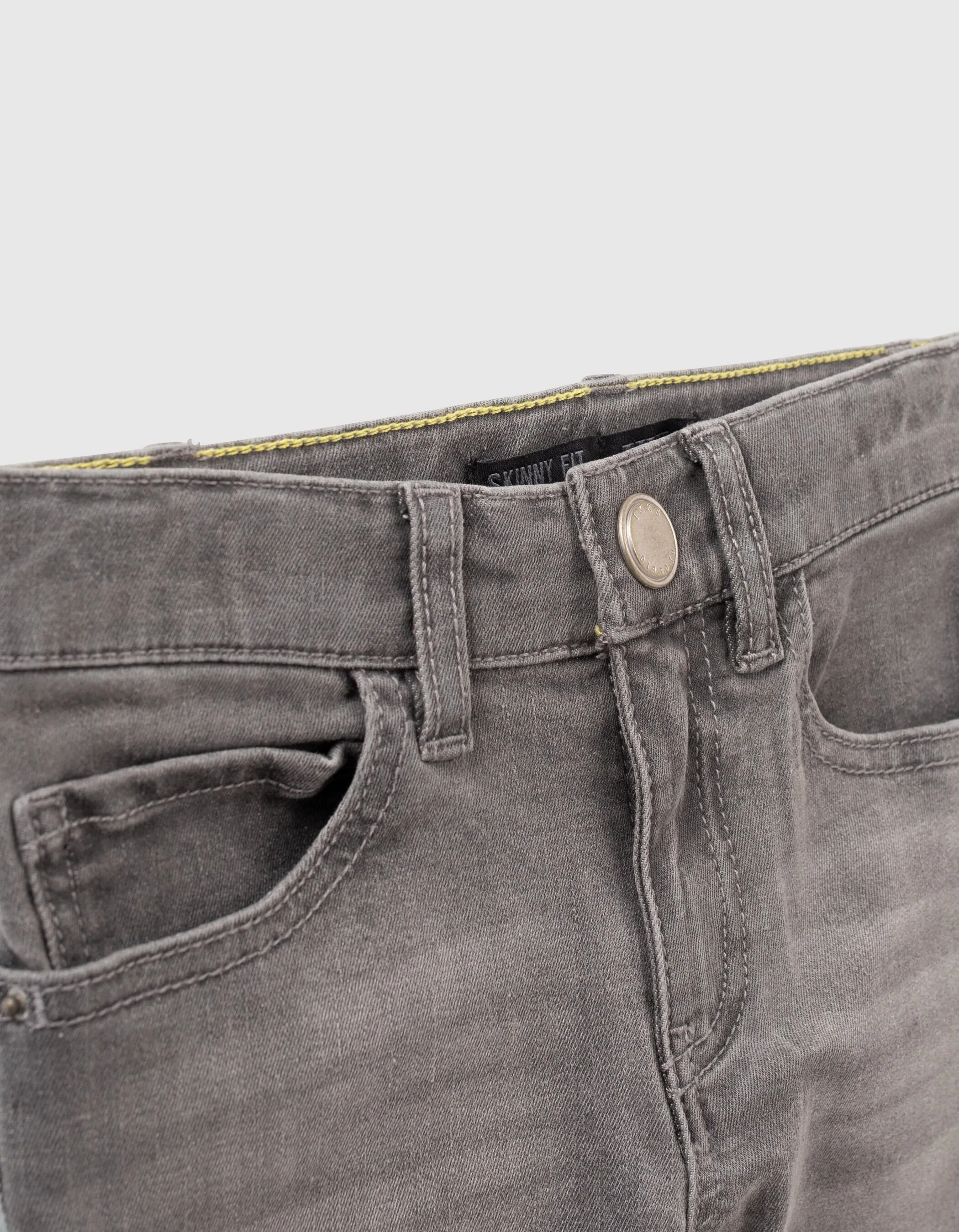 Jean skinny gris découpes genoux garçon