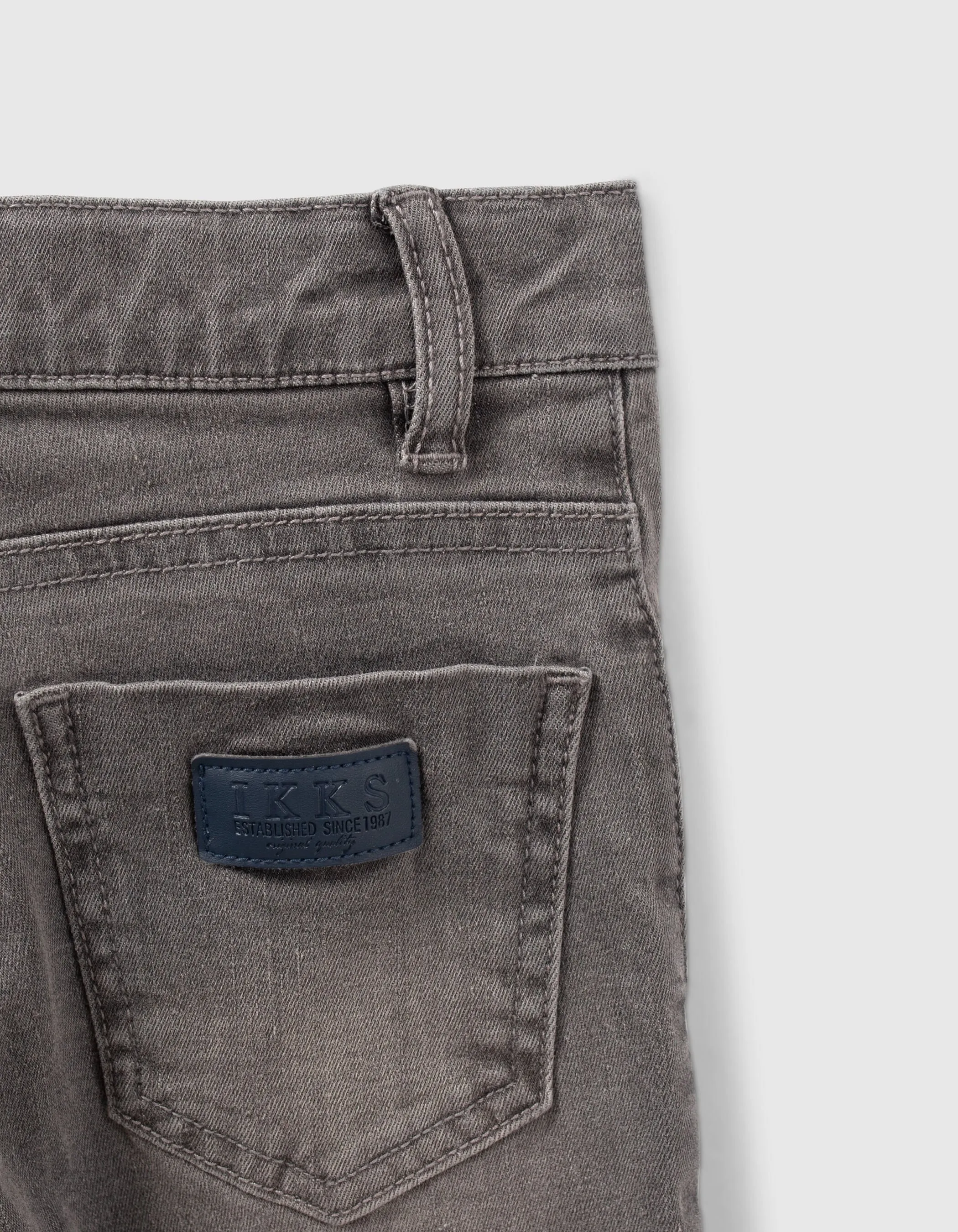 Jean skinny gris découpes genoux garçon