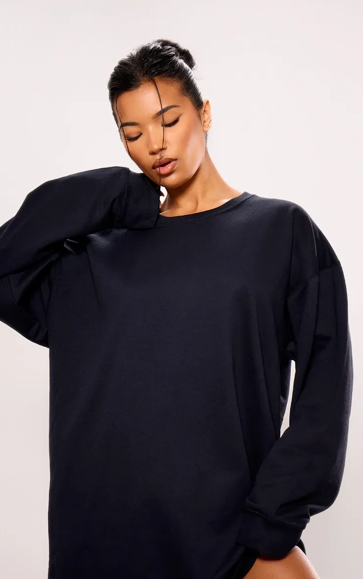 Robe pull noire oversize en sweat à manches longues