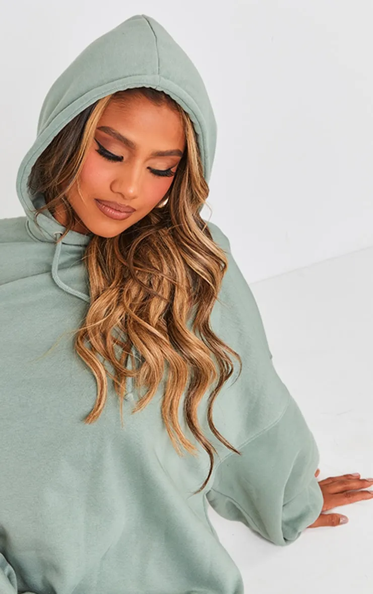 Robe pull oversize en sweat bleu-vert à capuche