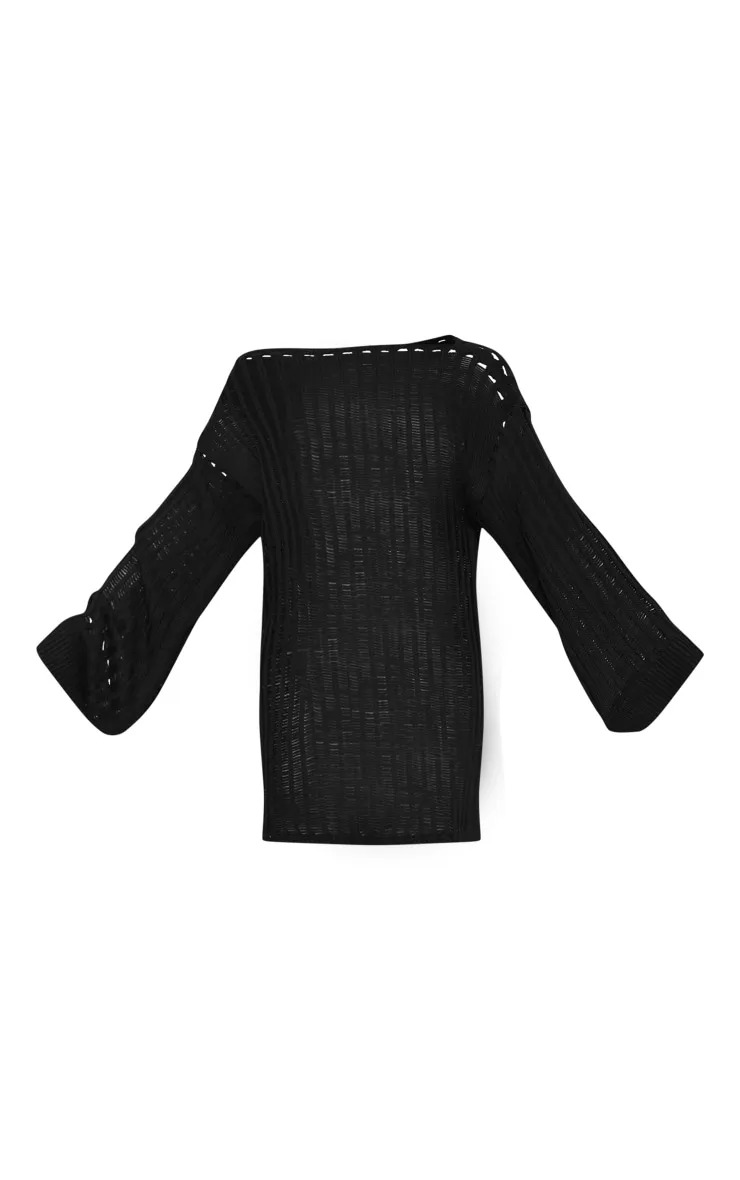 Robe pull oversize noire en maille tricot ajourée